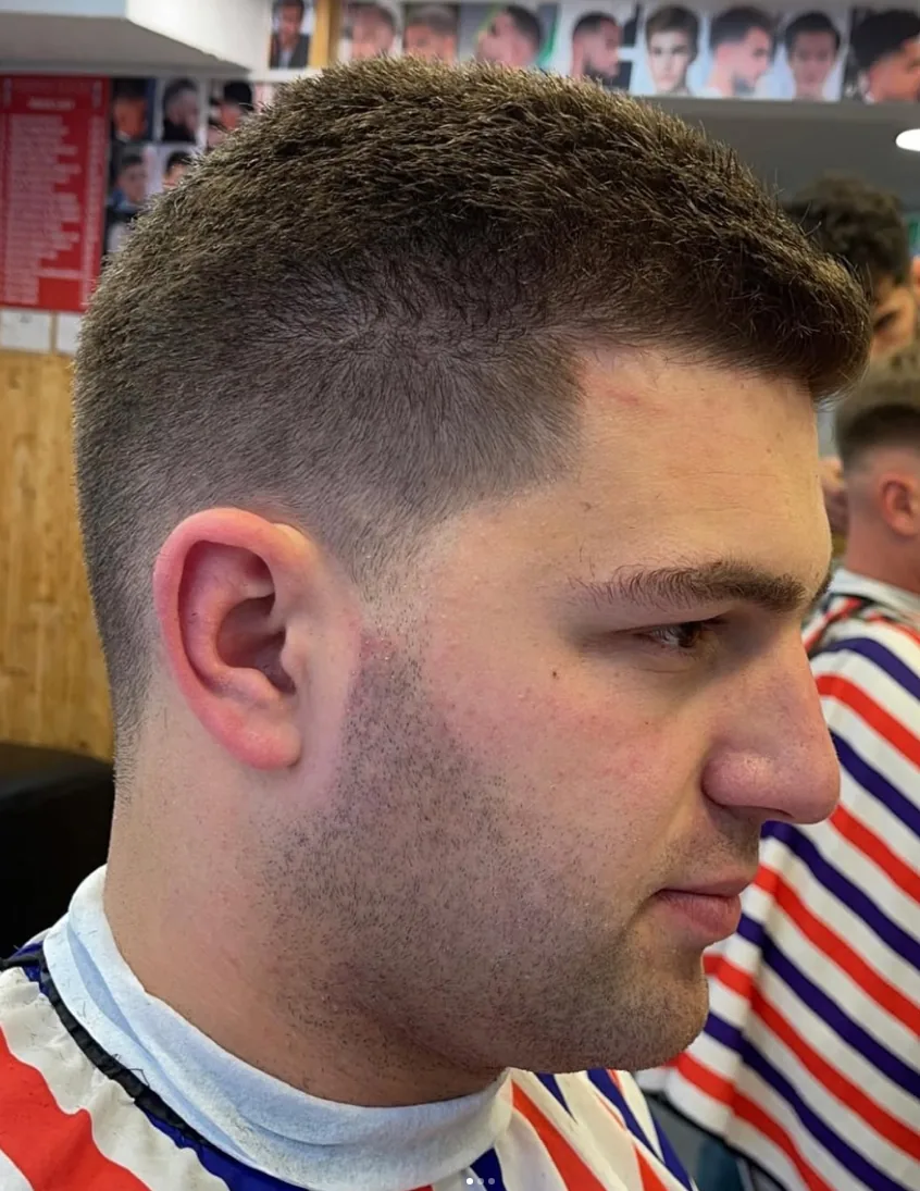 Close-up of a short textured haircut with faded sides