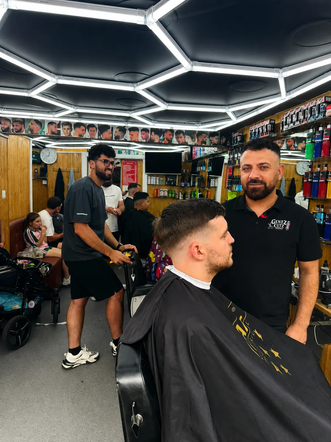 Gentz Cutz owner with a client after a fresh haircut